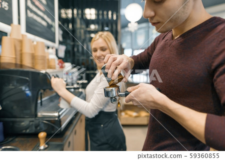 Barista man and woman making coffee, couple of young people working in coffee shop Barista man and woman making coffee, couple of young people working in coffee shop 59360855