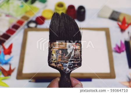 hand man holding paintbrush on tool art background. the tool for artist with copy space full color. Hobbies,free time,Lifestyle,they are for art and Drawing. hand man holding paintbrush on tool art background. the tool for artist with copy space full color. Hobbies,free time,Lifestyle,they are for art and Drawing. 59364710