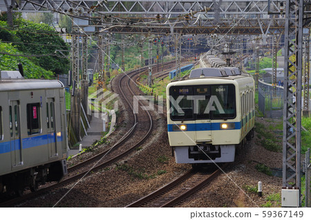 Trains traveling around Shinyurigaoka Station 59367149