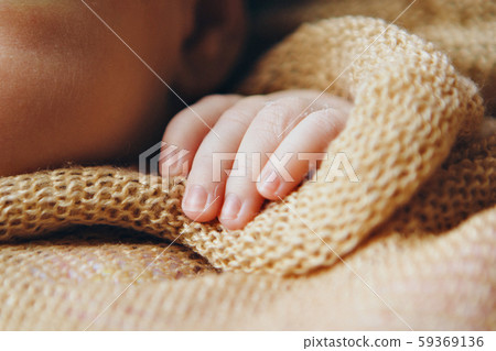 Baby's hand, fingers close up. newborn baby arms, massage concept of childhood, health care, IVF Baby's hand, fingers close up. newborn baby arms, massage concept of childhood, health care, IVF 59369136