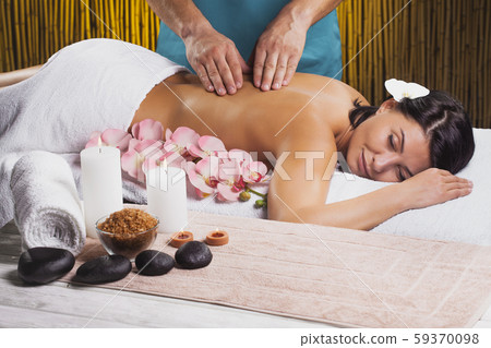 beautiful brunette woman in a massage salon beautiful brunette woman in a massage salon 59370098