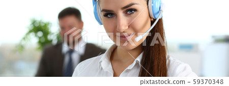 Beautiful brunette smiling call centre clerk at work Beautiful brunette smiling call centre clerk at work 59370348