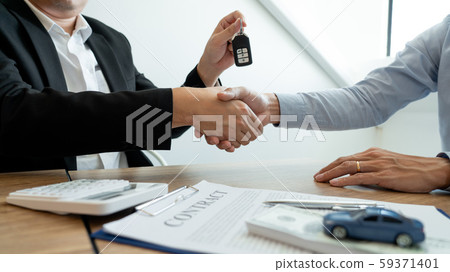 Businessman giving end key to customer after good Businessman giving end key to customer after good 59371401