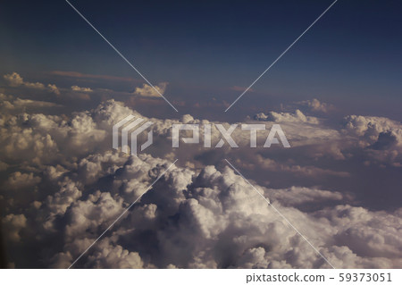Top view of clouds from an airplane window on a sunny day 59373051