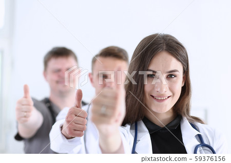 Group of doctor show OK or approval sign with thumb up Group of doctor show OK or approval sign with thumb up 59376156