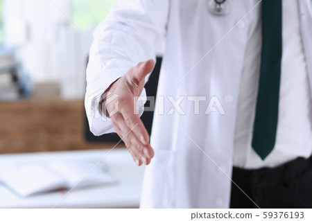 Male medicine doctor hold pad and give arm to shake 59376193