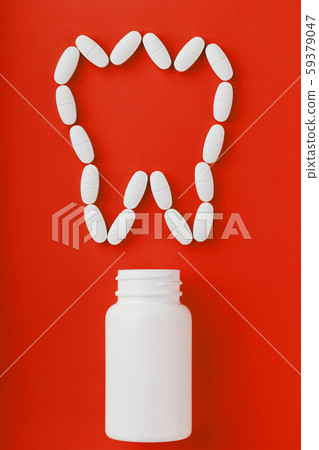 Calcium vitamin in the form of a tooth spilled out 59379047