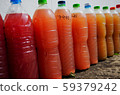 A bottle of natural red microbial water for watering plants 59379242