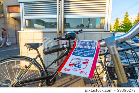 Yokohama cityscape in Japan, Hiyoshi station square, warning stickers affixed to abandoned bicycles in prohibited areas such as bicycles = Kohoku Ward, Yokohama City Yokohama cityscape in Japan, Hiyoshi station square, warning stickers affixed to abandoned bicycles in prohibited areas such as bicycles = Kohoku Ward, Yokohama City 59380272