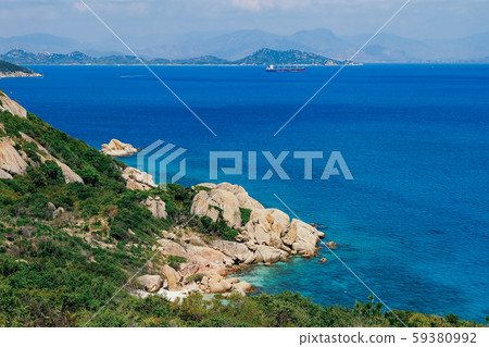 Seascape with wonderful cliff view and colorful clean sea water on the Binh Ba island, Vietnam. Royalty high quality free stock image of seascape. Seascape with wonderful cliff view and colorful clean sea water on the Binh Ba island, Vietnam. Royalty high quality free stock image of seascape. 59380992