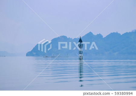 A small lighthouse in beautiful lake in a countryside Vietnam. Royalty high quality free stock image of nature landscape. A small lighthouse in beautiful lake in a countryside Vietnam. Royalty high quality free stock image of nature landscape. 59380994