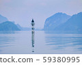 A small lighthouse in beautiful lake in a countryside Vietnam. Royalty high quality free stock image of nature landscape. A small lighthouse in beautiful lake in a countryside Vietnam. Royalty high quality free stock image of nature landscape. 59380995