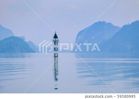 A small lighthouse in beautiful lake in a countryside Vietnam. Royalty high quality free stock image of nature landscape. 59380995