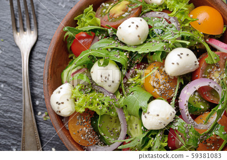 Flat lay of vegetable salad with mozzarella Flat lay of vegetable salad with mozzarella 59381083