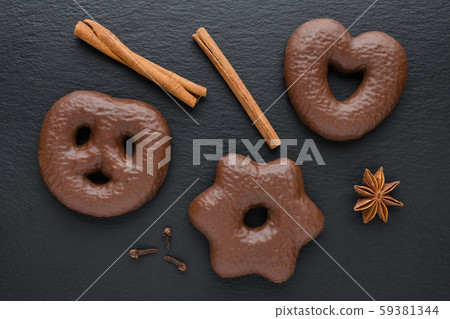traditional german christmas chocolate gingerbread lebkuchen with cinnamon sticks, anise and clove traditional german christmas chocolate gingerbread lebkuchen with cinnamon sticks, anise and clove 59381344