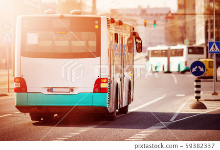 Bus moving on the road in city in early morning 59382337