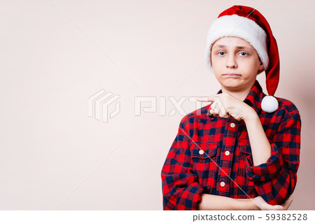 disappointed boy pointing on empty background disappointed boy pointing on empty background 59382528