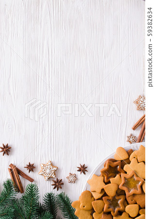 Christmas and culinary background with a plate of freshly baked Christmas gingerbread Christmas and culinary background with a plate of freshly baked Christmas gingerbread 59382634