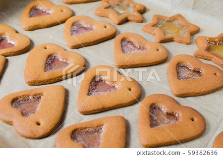 Freshly baked Christmas gingerbread ready to decorate with icing. Freshly baked Christmas gingerbread ready to decorate with icing. 59382636