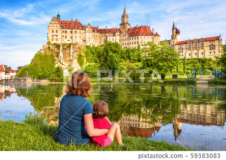 Family sit near medieval Sigmaringen Castle, 59383083