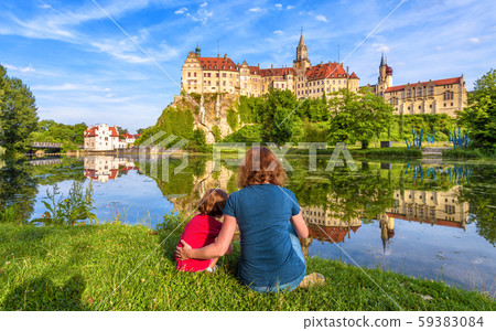 Family sit near medieval Sigmaringen Castle, 59383084