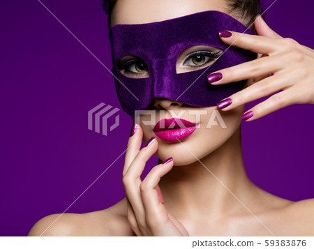 Portrait of a beautiful  woman with purple nails 59383876