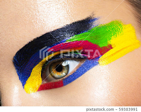 Woman's eye with vivid colors makeup Woman's eye with vivid colors makeup 59383991