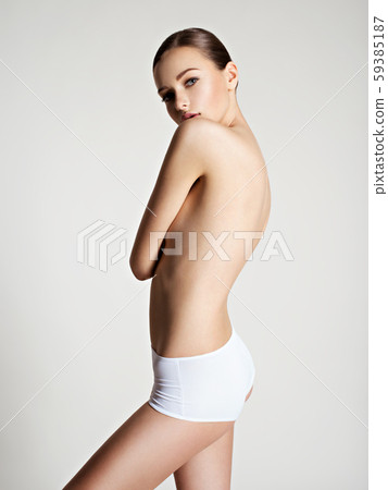 Beautiful woman with perfect body posing at studio Beautiful woman with perfect body posing at studio 59385187
