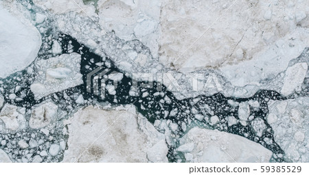 Icebergs drone aerial photo top view - Climate Change and Global Warming 59385529