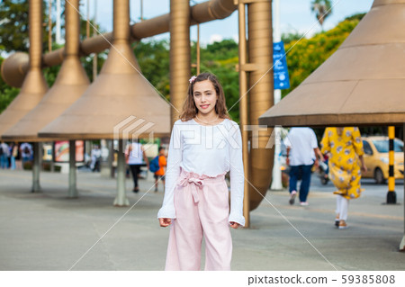 Beautiful young girl at the Jairo Varela Square in the city of Cali in Colombia Beautiful young girl at the Jairo Varela Square in the city of Cali in Colombia 59385808