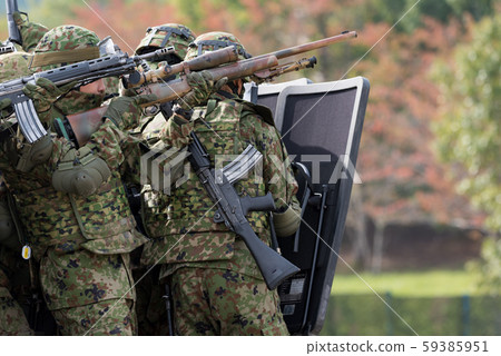 Self-defense officer holding a shield 59385951