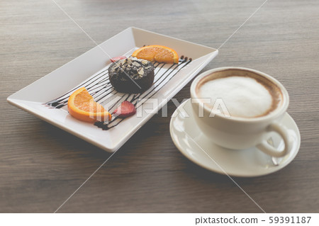 chocolate lava cake with fresh fruit and coffee 59391187