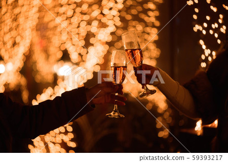 Two glasses of champagne over blur spots lights background. Celebration, free space for text Two glasses of champagne over blur spots lights background. Celebration, free space for text 59393217