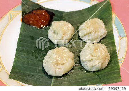 Kadubu or Steamed sweet momo  59397419