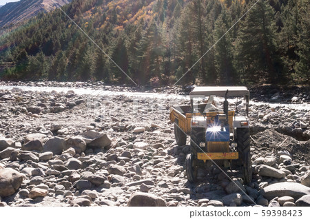 Autonomous dumper Truck Construction vehicle parked on industrial site on bank of Beas River Autonomous dumper Truck Construction vehicle parked on industrial site on bank of Beas River 59398423