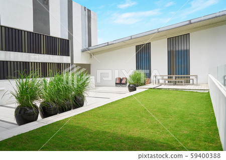 Outdoor patio with empty chair and table , Modern building , Malaysia . Outdoor patio with empty chair and table , Modern building , Malaysia . 59400388