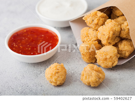 Crunchy southern chicken popcorn bites in paper Crunchy southern chicken popcorn bites in paper 59402627