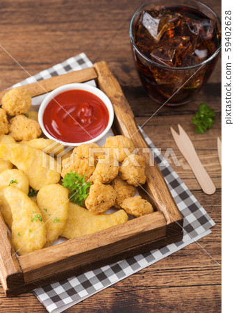 Buttered chicken nuggets and popcorn bites Buttered chicken nuggets and popcorn bites 59402628
