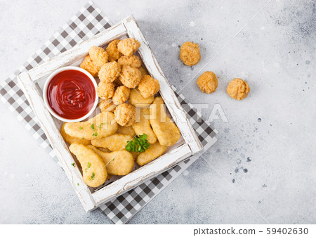 Buttered chicken nuggets and popcorn bites in Buttered chicken nuggets and popcorn bites in 59402630