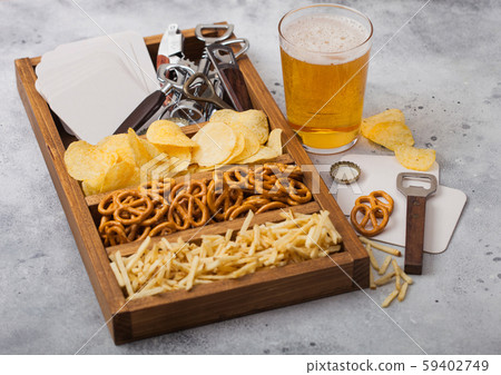 Glass of craft lager beer and opener with box Glass of craft lager beer and opener with box 59402749
