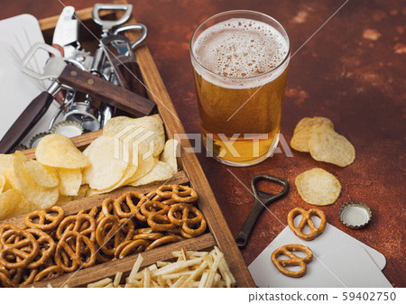 Glass of craft lager beer and opener with box Glass of craft lager beer and opener with box 59402750