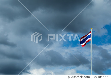 Thailand flag poles and a rain cloud 59404536