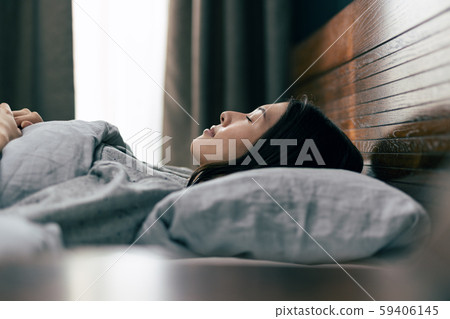Sleeping woman bed bedroom 59406145
