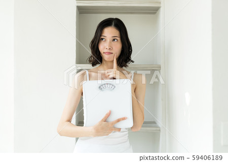 Diet, weight scale, women 59406189