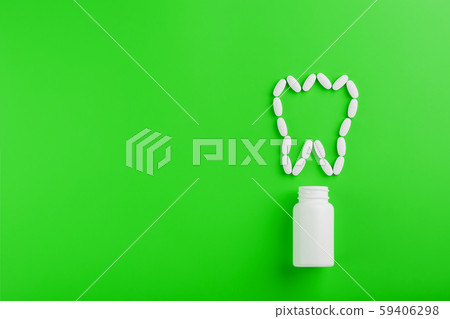 Calcium vitamin in the form of a tooth spilled out Calcium vitamin in the form of a tooth spilled out 59406298