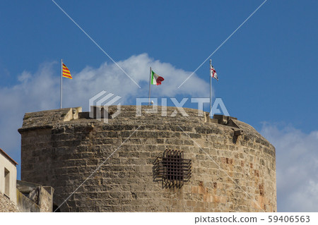 Torre di Porta Terra with three flags - catalan, italian and sar 59406563