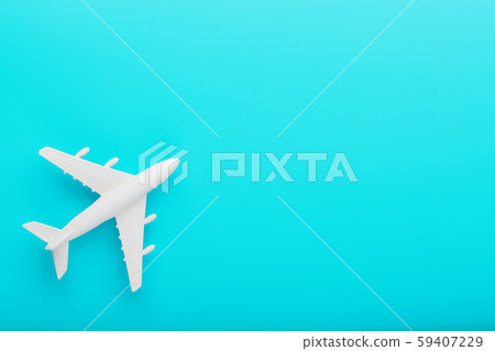 White passenger plane on a blue background. Free space. 59407229
