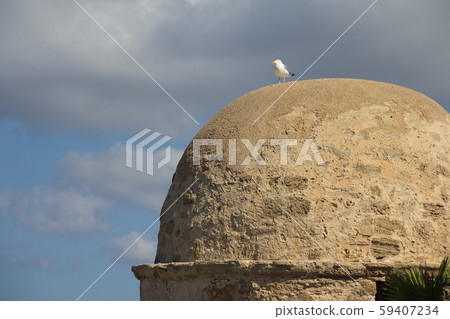 The fortress tower of old Alghero town bastion in Sardinia 59407234