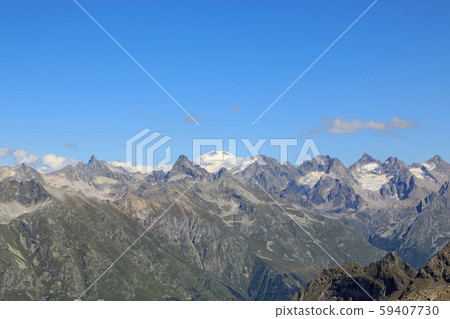 Panorama view of dramatic sky and mountains scene Panorama view of dramatic sky and mountains scene 59407730