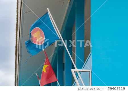 The old Association of South East Asian Nations flag with a big hole decorative on the building The old Association of South East Asian Nations flag with a big hole decorative on the building 59408619